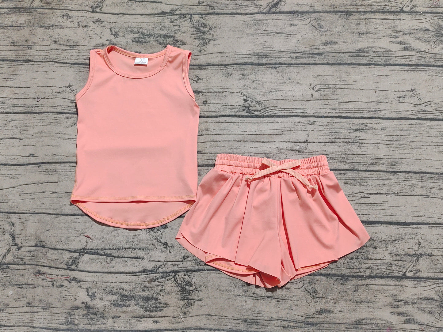 8.01 GSSO2502 Sample No Moq Fast Coming Baby Girls Yoga Outfits Baby Girls Peach Sleeveless Top Skorts Sets